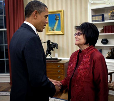 President Barack Obama and late American Indian Activist Elouise Cobell shaking hands in the White House.